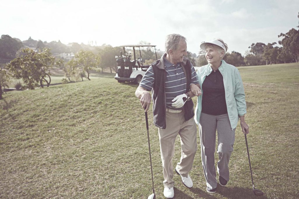 Retired Couple Playing Golf
